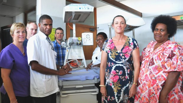 Saving babies: From left are Christine Jackson, Australian government-funded midwives trainer; Scott Everden, Australian government-funded medical engineer; Sam Mahit, maternity ward assistant manager;  Scott Monteiro, Australian government-funded procurement manager; Jeannette Barry, maternity ward manager; Tanya Parkin, Australian deputy high commissioner; and Leipakoa Matariki, Vila Central Hospital manager with a resuscitaire.