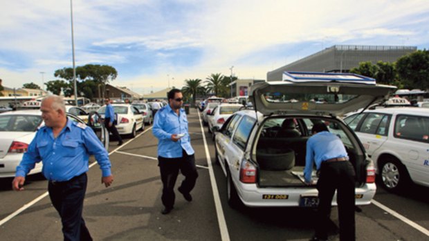 Long wait ... taxi drivers are being froced to queue for up to an hour at Sydney Airport.