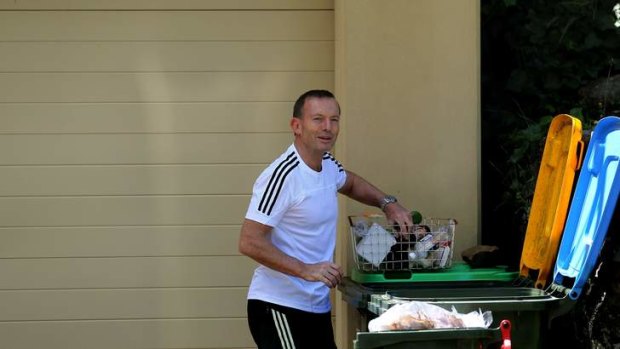 "It's always a beautiful morning in Forestville": Prime Minister Tony Abbott talks with Fairfax reporters as he sorts his recycling.