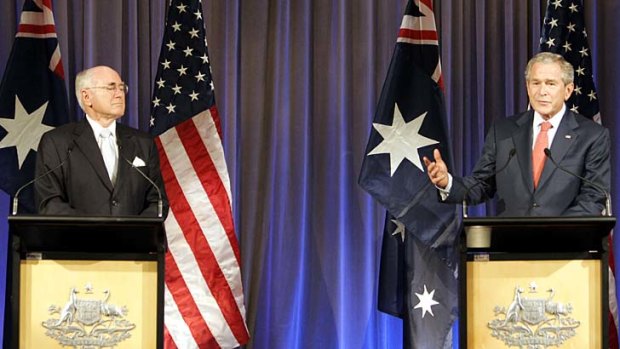 John Howard (L) suspended disbelief to support George W. Bush's invasion of Iraq.