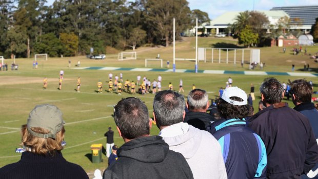 Weighing in on athletic bursaries: Parents watch as Saint Ignatius' College, Riverview, plays Scots College.