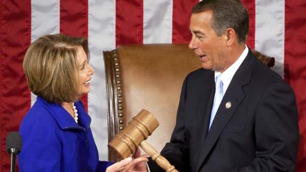 House Minority Leader Nancy Pelosi hands the gavel to John Boehner.