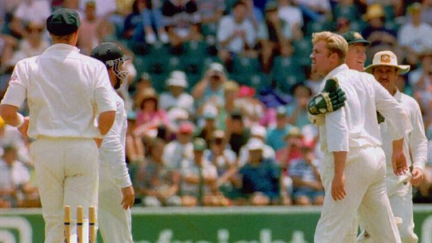 Squaring up: Shane Warne crosses swords with South African batsman Andrew Hudson in 1994.