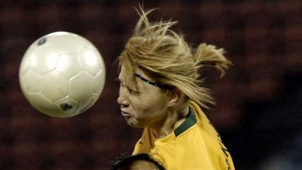 Up for it ... Australia's Clare Polkinghorne rises above Taiwan's Li Chen tasi for a header.