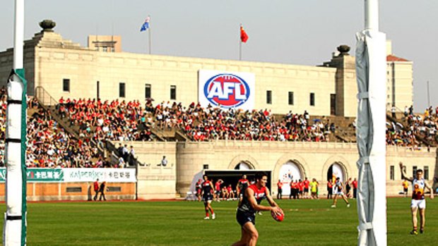 Colin Garland of the Demons in action during yesterday’s match in Shanghai. Melbourne won, 12.12 (84) to the Brisbane Lions’ 11. 13 (79).