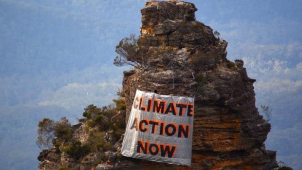 One sister's opinion: a banner hung by climate activists in the Blue Mountains on Sunday.