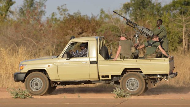 Partnership ... French soldiers sit aboard a Malian military armed car at the 101 military airbase near Bamako.