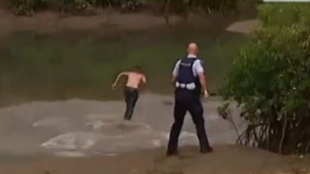 An ABC cameraman captured the moment the escapees evaded police in a crocodile-inhabited swamp.