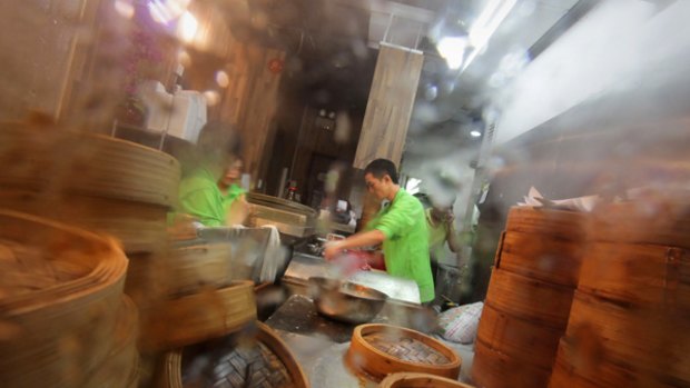 A busy chef at Hong Kong's small and steamy Tim Ho Wan restaurant.