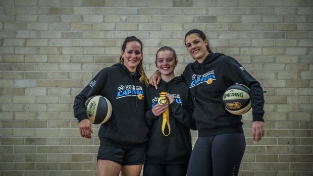 (from left) University of Canberra Capitals? players Keely Froling, Abbey Wehrung and Lauren Scherf have returned home after helping the Emerging Opals win gold at the World University Games in Taipei. Photo by Karleen Minney.
