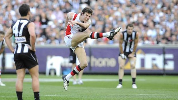 Lenny Hayes, who fired the Saints all day, kicks a last-quarter goal.