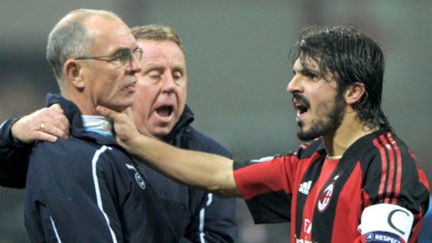AC Milan midfielder Gennaro Ivan Gattuso argues with Spurs assistant manager Joe Jordan.