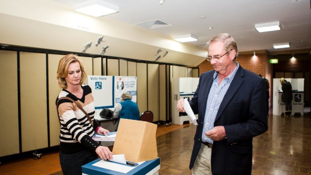 Queanbeyan-Palerang Regional Council administrator Tim Overall, and his wife Nicole submit their vote.