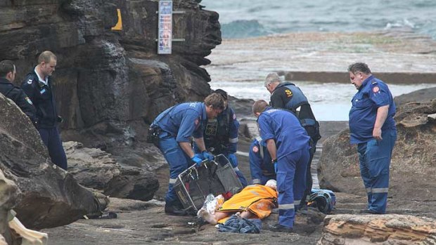 Rescuers prepare the injured man for evacuation to hospital.