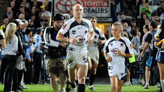 Man of the moment ... Darren Lockyer jogs out for his 350th game, breaking the record of Steve Menzies and Terry Lamb.