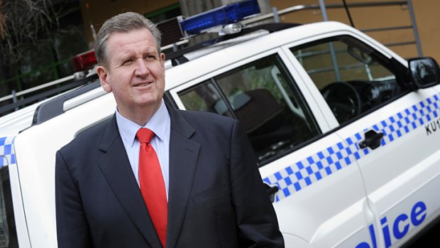 Law man ... Opposition Leader Barry O’Farrell ‘‘on patrol’’ outside Gordon police station yesterday.
