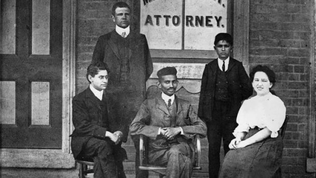 Where it all began: Mohandas K. Gandhi (centre) outside his office in South Africa in 1901.