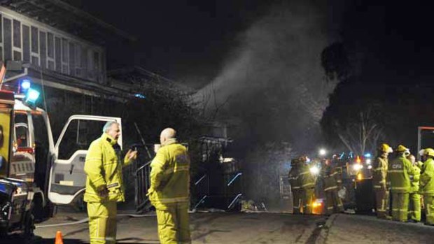 A building smoulders after firefighters attend a fire that broke out at Pembroke Secondary College in Mooroolbark this evening.