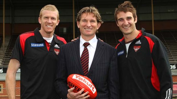 James Hird, flanked by key Bombers Dustin Fletcher and  Jobe Watson.
