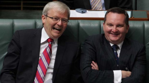 Then Foreign Affairs Minister Kevin Rudd and Immigration Minister Chris Bowen share a laugh during Question Time.