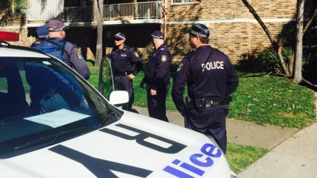 Police raid the Wentworthville unit.