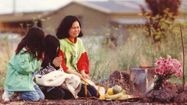 Phyllis Chan and her daughters perform a service for Karmein in May 1992 at the spot where her body was discovered in Thomastown