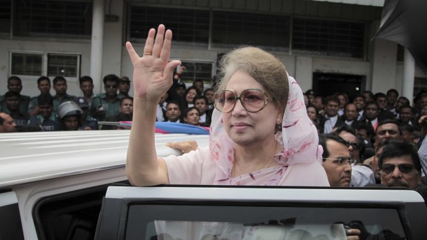 Former Bangladeshi Prime Minister Khaleda Zia waves as she leaves after a court appearance in Dhaka on Sunday. 