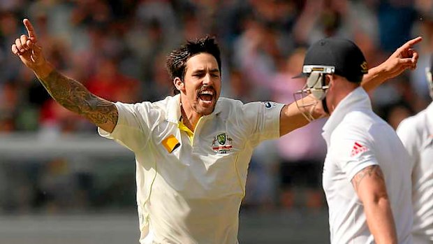 Mitch invasion:  Mitchell Johnson celebrates his dismissal of Ben Stokes at the MCG.