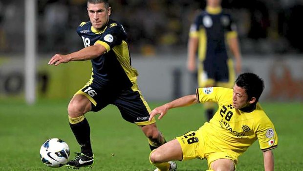Scraped through: Nick Montgomery of the Mariners in the 3-0 loss to Kashiwa in the AFC Champions League on Tuesday but other results saw the A-League champions through to the knockout stage.
