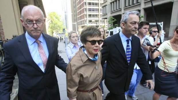 Shirley Justins leaves court after receiving 22 months.