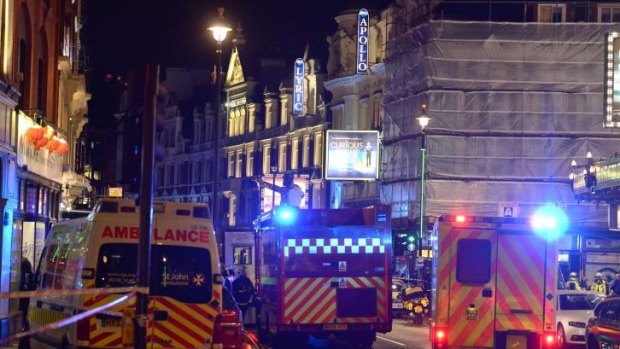 Emergency services attend the scene at the Apollo Theatre in Shaftesbury Avenue, central London.