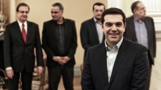 Greece's newly-appointed Prime Minister Alexis Tsipras, 40, poses before taking a secular oath at the Presidential Palace.