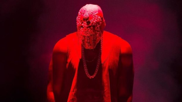 Who is that masked man? Kanye West performs for fans at Qantas Credit Union Arena.