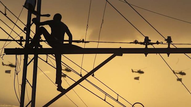 A protester opposing Egyptian President Mohamed Mursi climbs on top of an electric pole to take a look at military helicopters flying over El-Thadiya presidential palace during a protest demanding Mursi to resign.