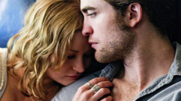 Lost lovers ... Emilie de Ravin and Robert Pattinson in Remember Me. Photo: Nicole Rivelli