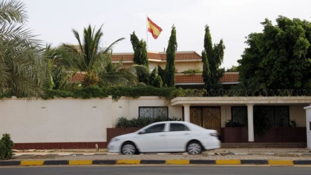 A car drives past the house of a Spanish diplomat who had been found there stabbed to death.