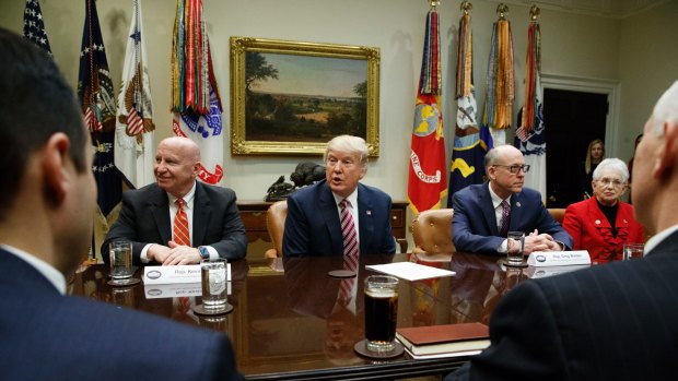 President Donald Trump speaks during a meeting on healthcare in the Roosevelt Room of the White House.