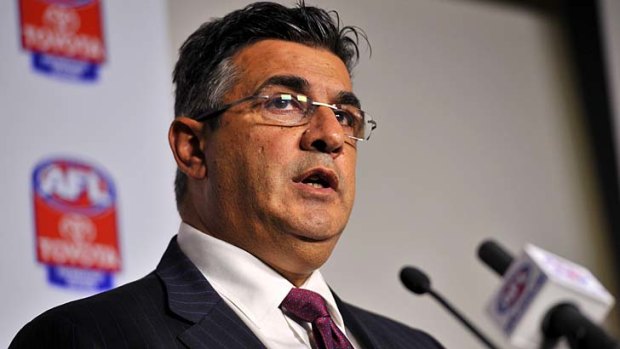 AFL CEO Andrew Demetriou releases the charges against Essendon at AFL House yesterday.