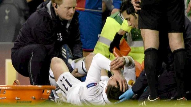 Tottenham Hotspur's Gareth Bale is stretchered off with a serious ankle injury.