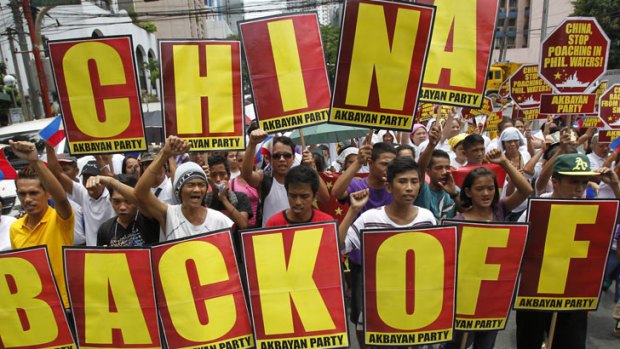 Protesters chant anti-China slogans as they march towards the Chinese consulate in Manila's Makati financial district May 11, 2012.