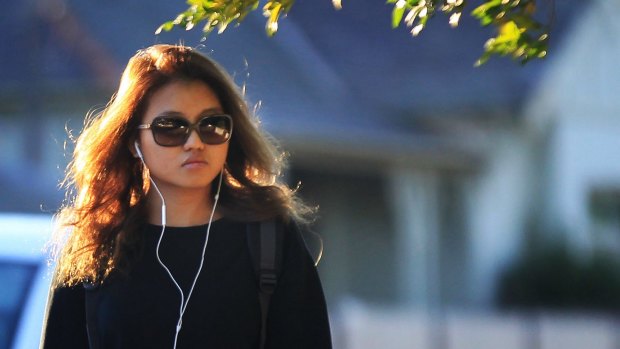 Christine Jia Xin Lee leaves Ryde police station in Sydney. 