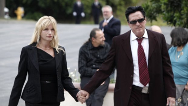 Michael Madsen, right, and guest arrives to the funeral of  David Carradine in Los Angeles on Saturday.