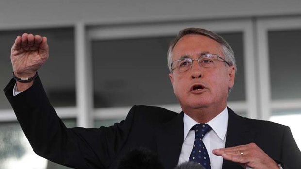Cost cutting: Treasurer Wayne Swan's budget will hurt Australian families.