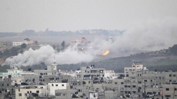 Smoke and flames are seen during an Israeli offensive in the east of Gaza City.