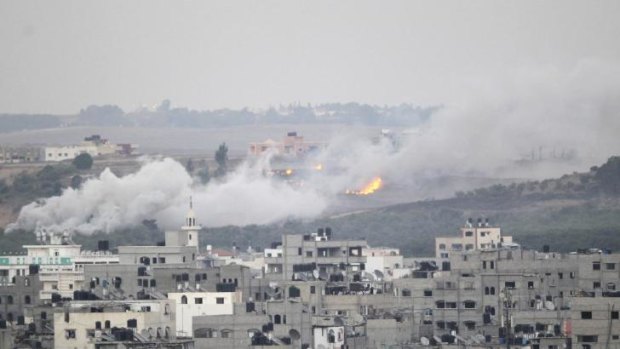 Smoke and flames are seen during Israeli offensive in the east of Gaza City.