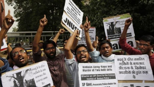 Members of a university students' union shout slogans during a protest against the gang-rape of two teenage girls in Katra village, outside the Uttar Pradesh state house, in New Delhi.