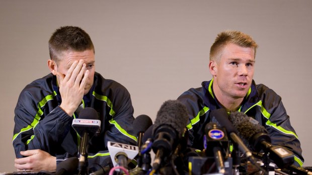 The way we were: Michael Clarke, left, and David Warner address the media after Warner's pub incident with England's Joe Root.