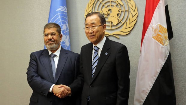 United Nations Secretary-General Ban Ki-moon (right) meets with Egyptian President Mohamed Mursi at the United Nations during a meeting at the General Assembly in New York City.