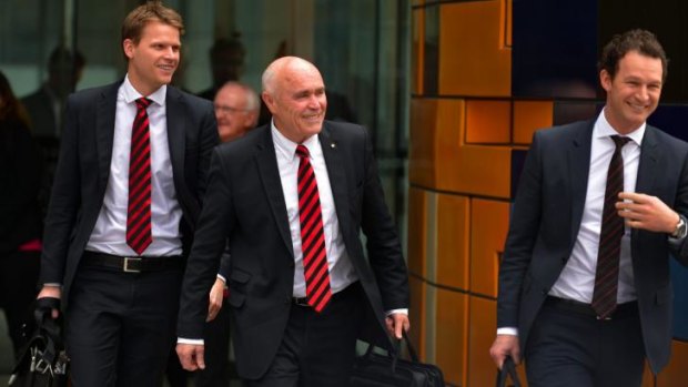 Essendon chief marketing officer Justin Rodski, chairman Paul Little and chief operating officer Xavier Campbell leave the Federal Court for lunch on Tuesday. 