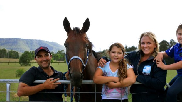Much loved: Trainer Michael Formosa with wife Kirsty, daughters Chloe and Emme, and Inter Dominion hope Ultimate Art.